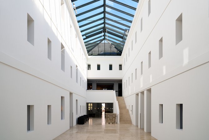 The atrium of the Grey Monastery – a neo-classical white courtyard with a glass roof