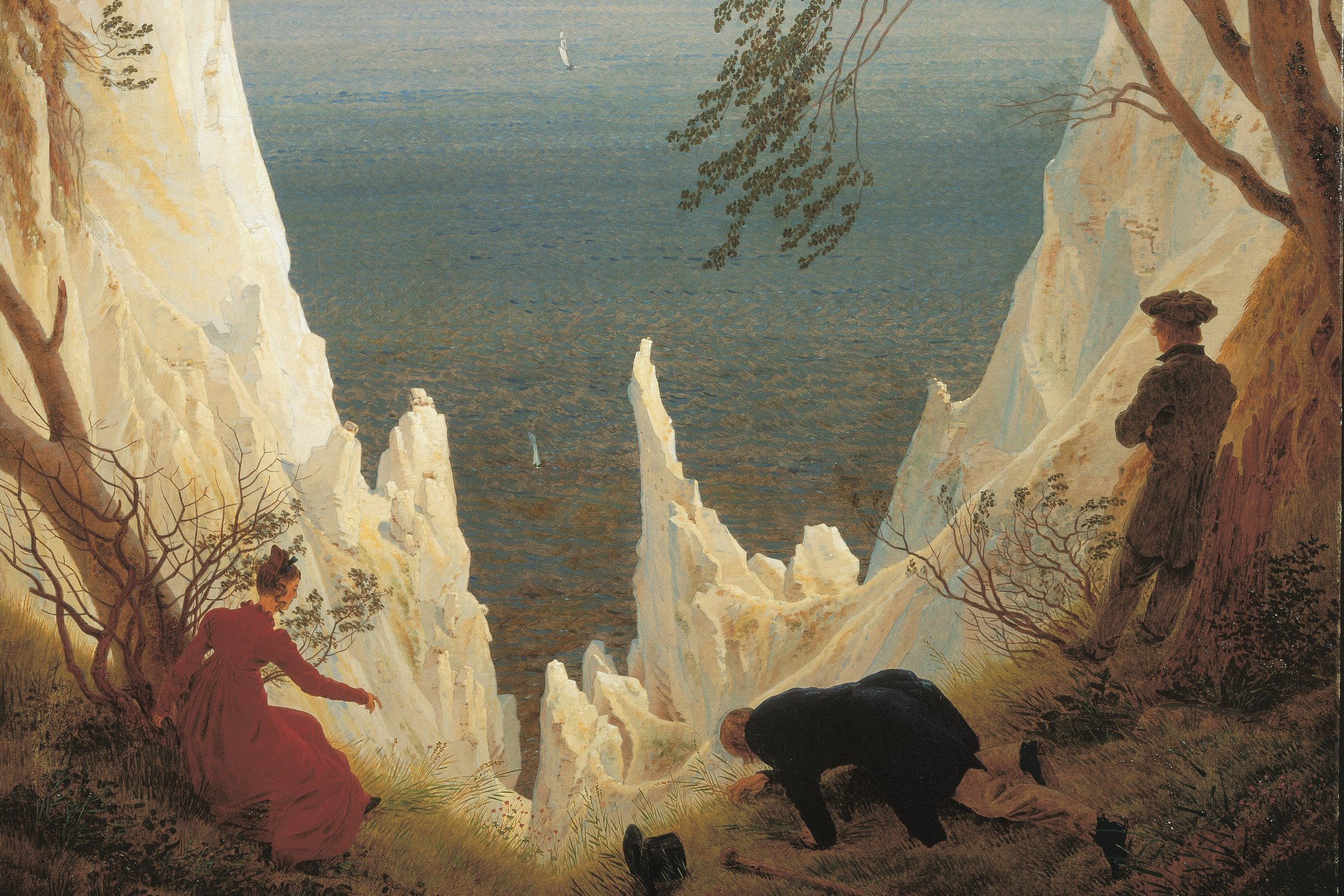 Gemälde mit drei Figuren im Vordergrund, eine Frau im roten Kleid und zwei Männer, einer davon stehend, einer knieend. Dahinter steil aufragende Kreidefelsen vor See-Hintergrund.